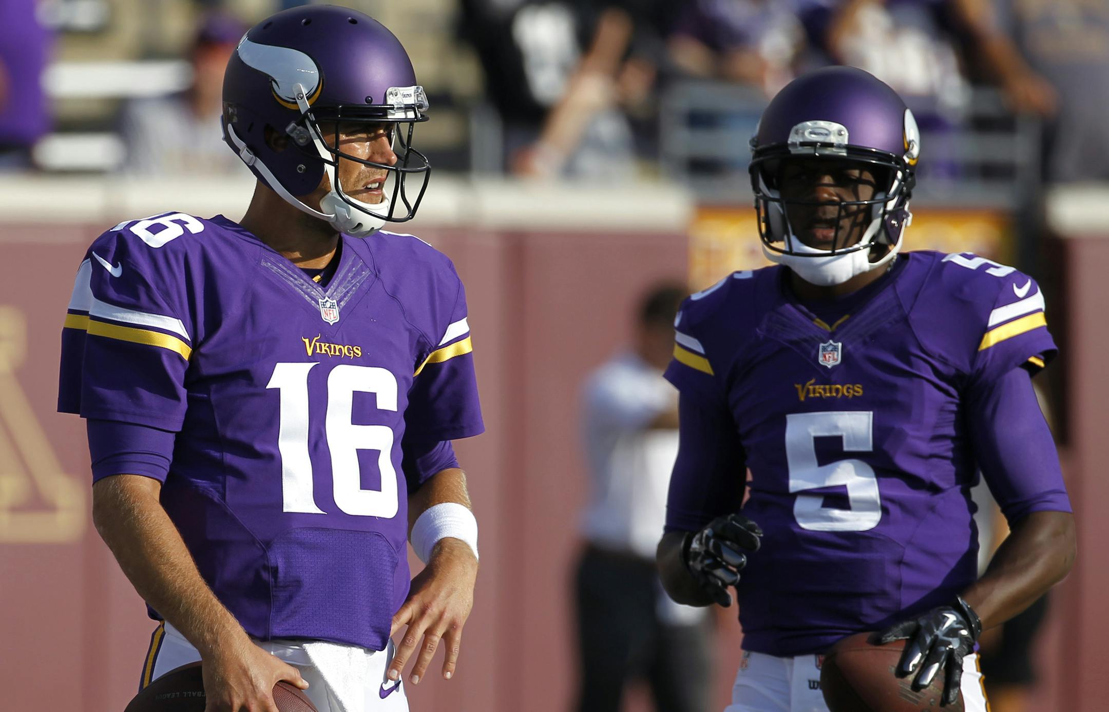Minnesota Vikings quarterback Matt Cassel (16) and Minnesota Vikings quarterback Teddy Bridgewater (5) wait to throw before a exhibition NFL football game at TCF Bank Stadium in Minneapolis, Friday, Aug. 8, 2014. (AP Photo/Ann Heisenfelt) ORG XMIT: MIN2014082518065561 ORG XMIT: MIN1408251808358224