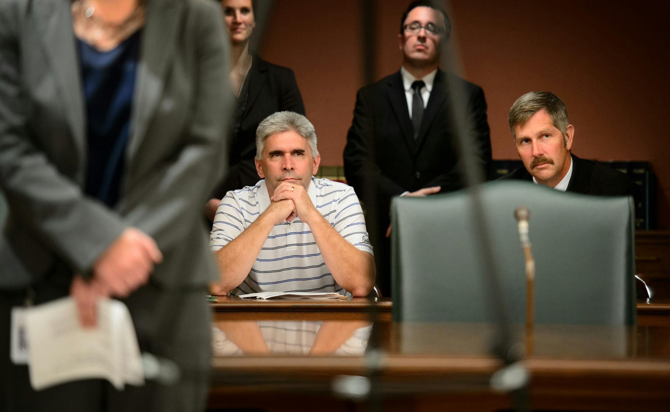 State Rep. Joe Atkins (DFL-Inver Grove Heights) and State Sen. Tony Lourey (DFL-Kerrick) listened as Commerce Commissioner Mike Rothman talked about the MNsure insurance rates Friday, September 6, 2013. Atkins and Lourey are both bill authors of legislation to create Minnesota's health insurance exchange. The Commerce Department announced that rates for insurance companies selling plans on the new MNsure exchange, which launches Oct. 1, are the lowest average in the country.