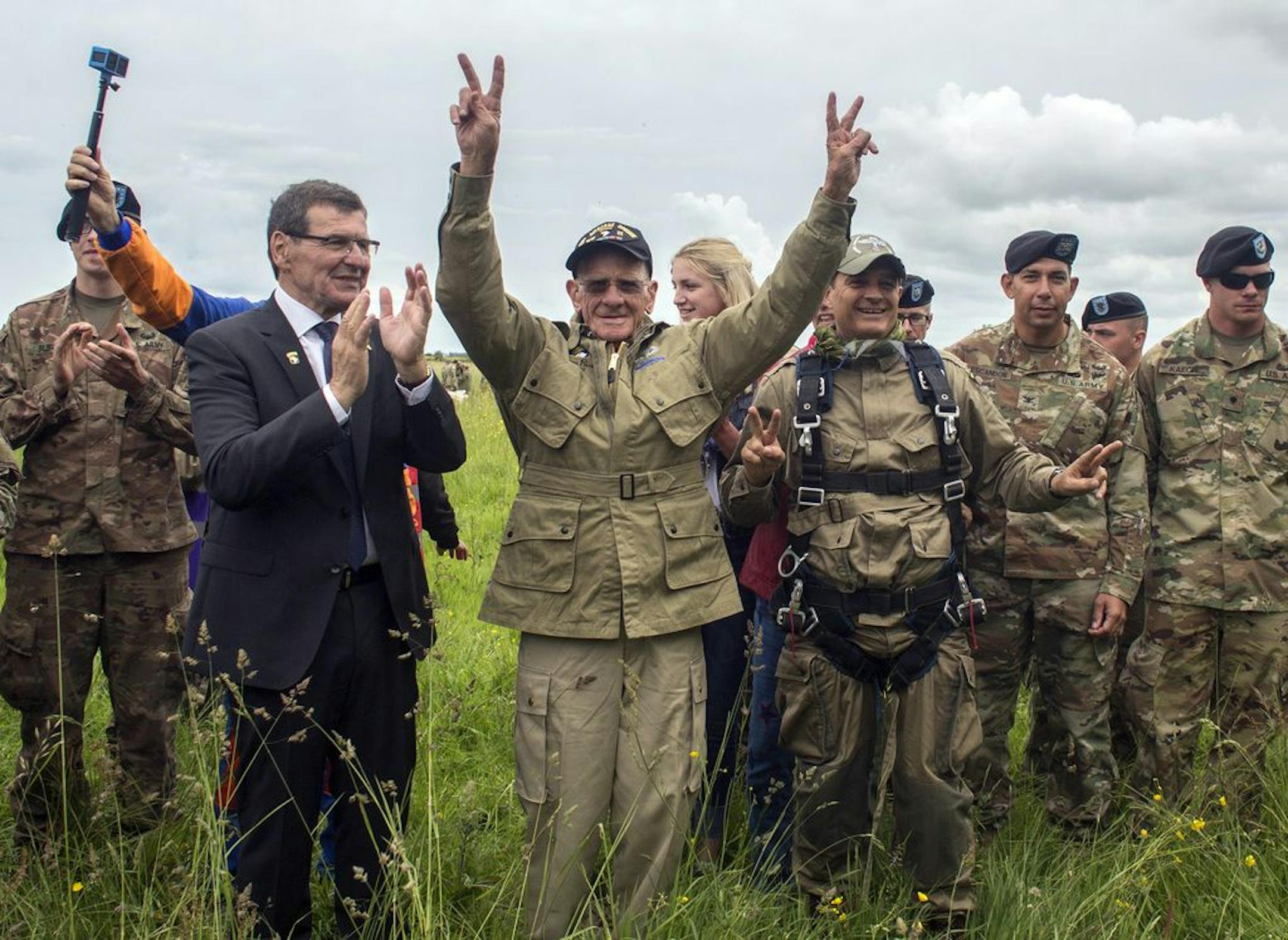 U.S. World War II D-Day veteran Tom Rice, from Coronado, CA, after parachuting in a tandem jump into a field in Carentan, Normandy, France, Wednesday, June 5, 2019. Approximately 200 parachutists participated in the jump over Normandy on Wednesday, replicating a jump made by U.S. soldiers on June 6, 1944 as a prelude to the seaborne invasions on D-Day.