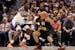 Anthony Edwards (5) of the Timberwolves defends against Jamal Murray (27) of the Denver Nuggets in the first quarter at Ball Arena in Denver on Tuesda