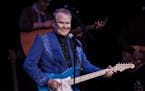 FILE &#x2014; Glen Campbell performs during &#x201c;The Goodbye Tour,&#x201d; less than a year after he disclosed his diagnosis of Alzheimer&#x2019;s 