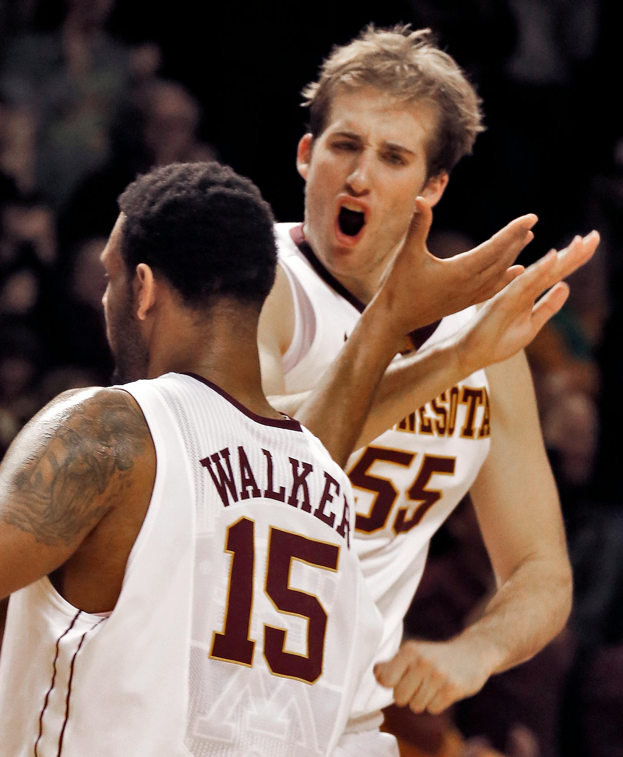 Maurice Walker and Elliott Eliason celebrated a Walker field goal during a time out against Wisconsin.