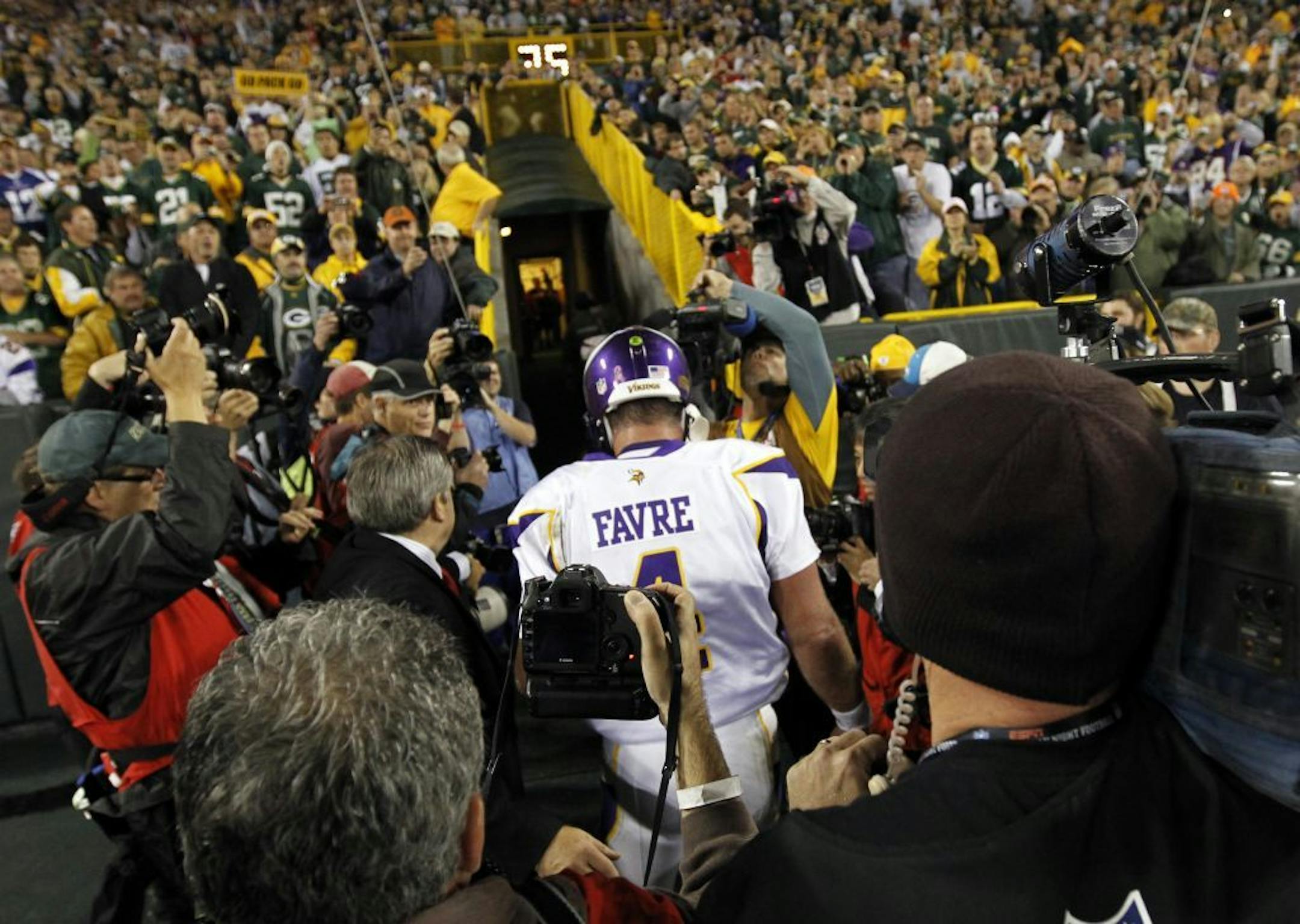 Vikings quarterback Brett Favre (4) walked off the field at the end of the game. Green Bay beat Minnesota by a final score of 28-24.