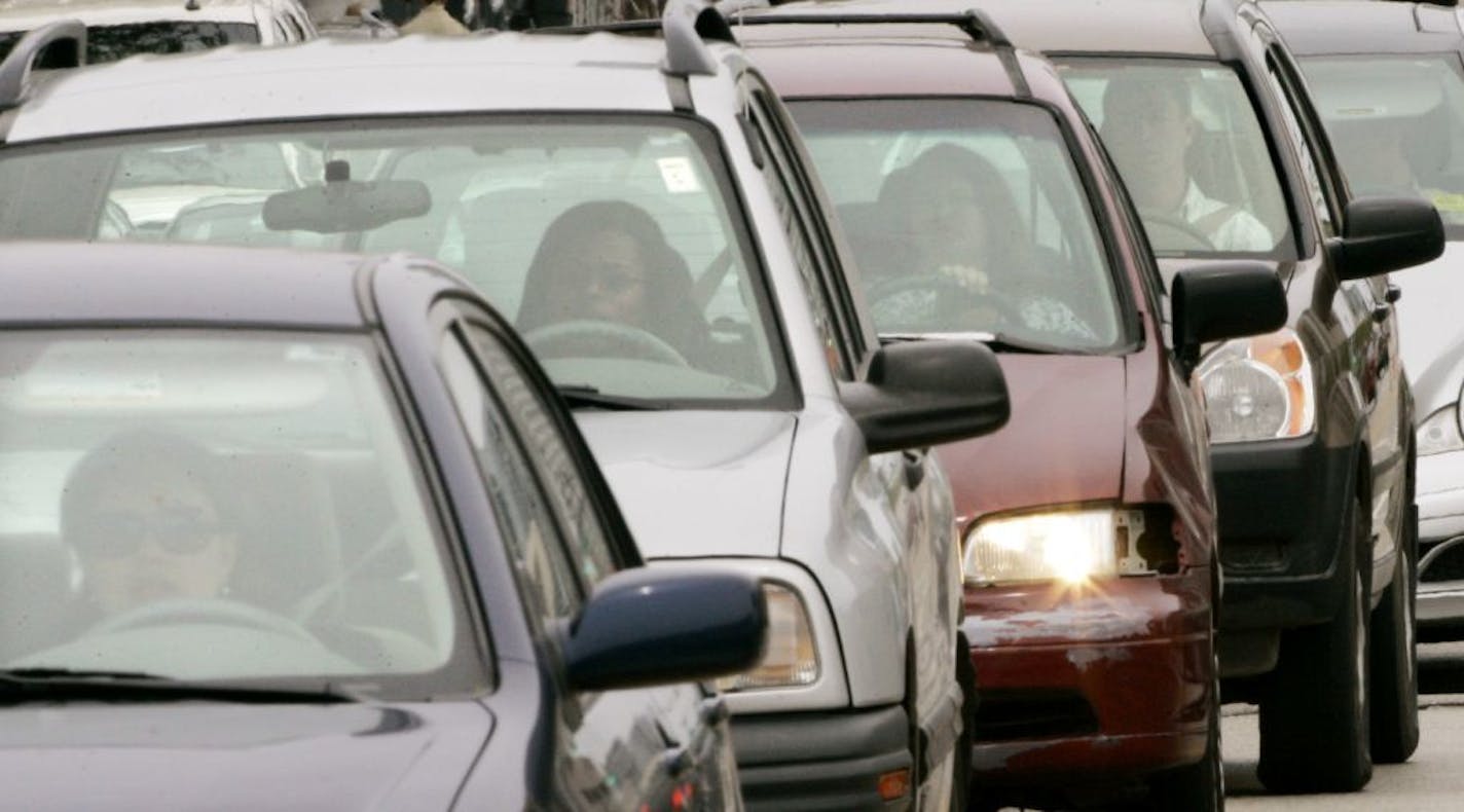 Motorists sit in a Chicago traffic jam in 2008. More than 800 rear-seat passengers who weren't wearing seat belts were killed in 2018 in U.S. traffic crashes, and states aren't making enough progress in getting people to buckle up, the Governors Highway Safety Association says in a report released Monday, Nov. 18, 2019.