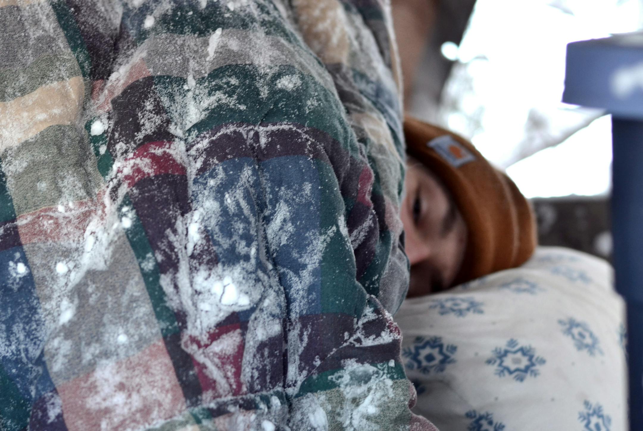 In this Dec. 6, 2013 photo provided by his father Mark Hummel, Rudy Hummel is bedded down in treehouse outside his home in Hermantown, Minn.