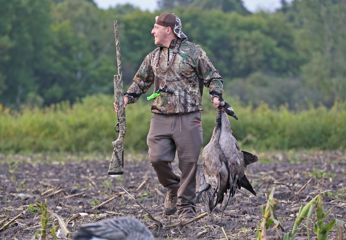 Mitch Lunda toted a pair of Canada geese back to his blind while hunting in the east metro Saturday, opening day of the early goose season. Success came despite a poor hatch of Canada geese this spring.