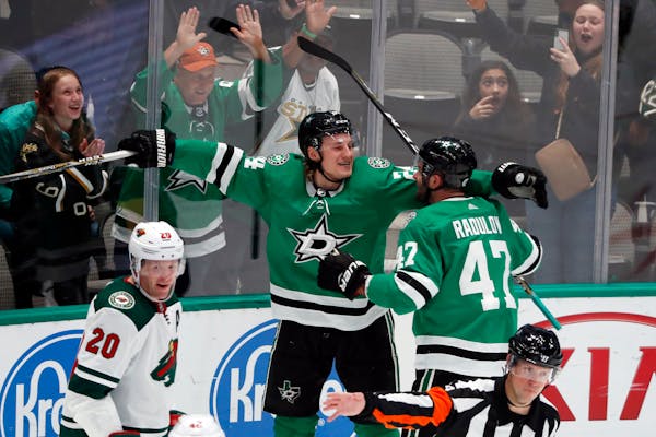 Dallas Stars left wing Roope Hintz and Alexander Radulov celebrate a goal scored by Hintz as the Wild's Ryan Suter looks away in the third period. Dal