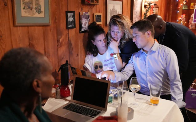 Minneapolis Council President Andrea Jenkins sat with Mayor Jacob Frey and Jenkins’ campaign manager, Kristina Mitchell, as they waited for election