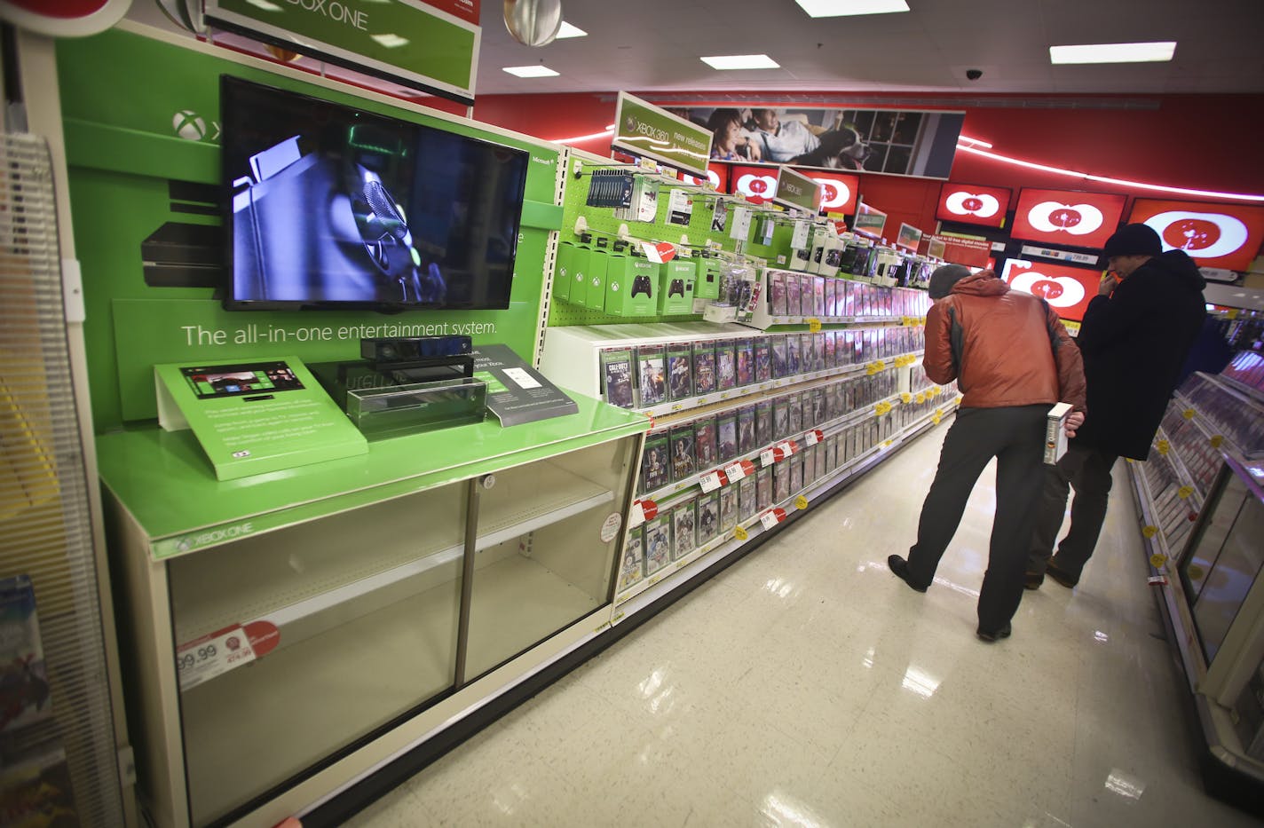 Customers looked at XBox games despite the fact that all the Xbox Ones were sold out at Target in downtown Minneapolis, Minn., on Wednesday, December 4, 2013. With the introduction of Play Station 4 and XBox One, the first new video game consoles in 7 years, Best Buy and other retailers are hoping for a big lift to their holiday sales. ] RENEE JONES SCHNEIDER &#x2022; reneejones@startribune.com