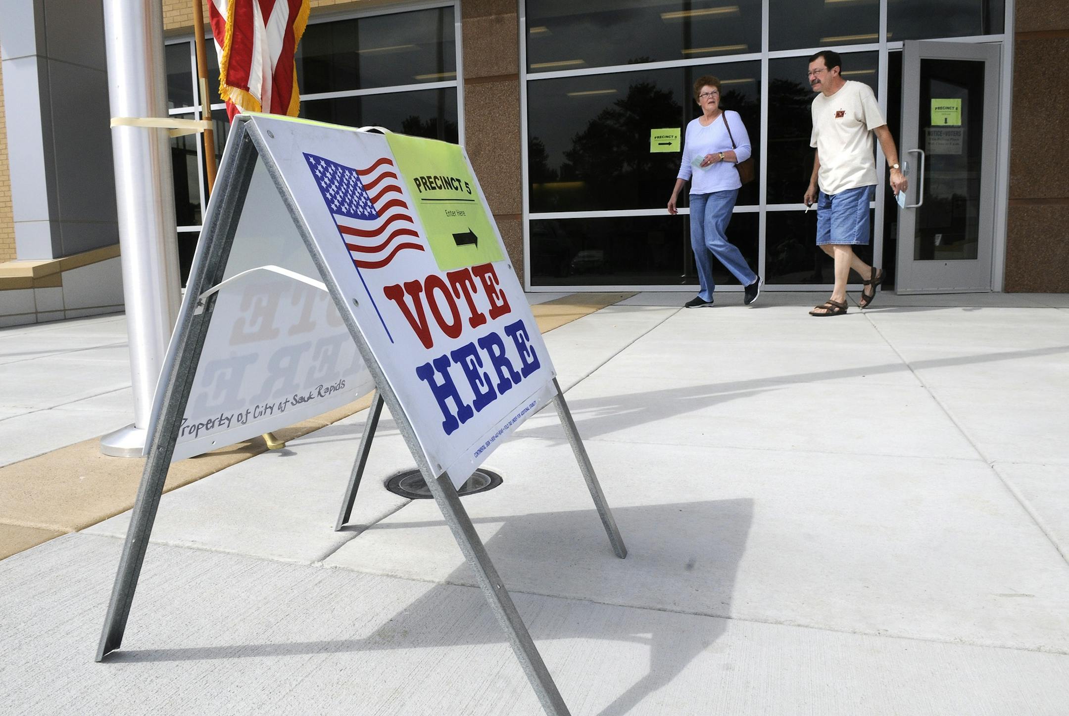 Sauk Rapids, Minn., residents Carol and Alan Zeringue exit the Sauk Rapids Government Center Tuesday, Aug. 14, 2012 after voting in the city's precinct 5 for the primary election. Election judges at the precinct said the number of voters they'd seen by the afternoon were low.