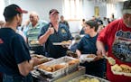 Bill Miller gave a thumbs-up to a fellow firefighter about the taste of the smelt at a fundraiser for the Jump River Volunteer Fire Department. Wiscon