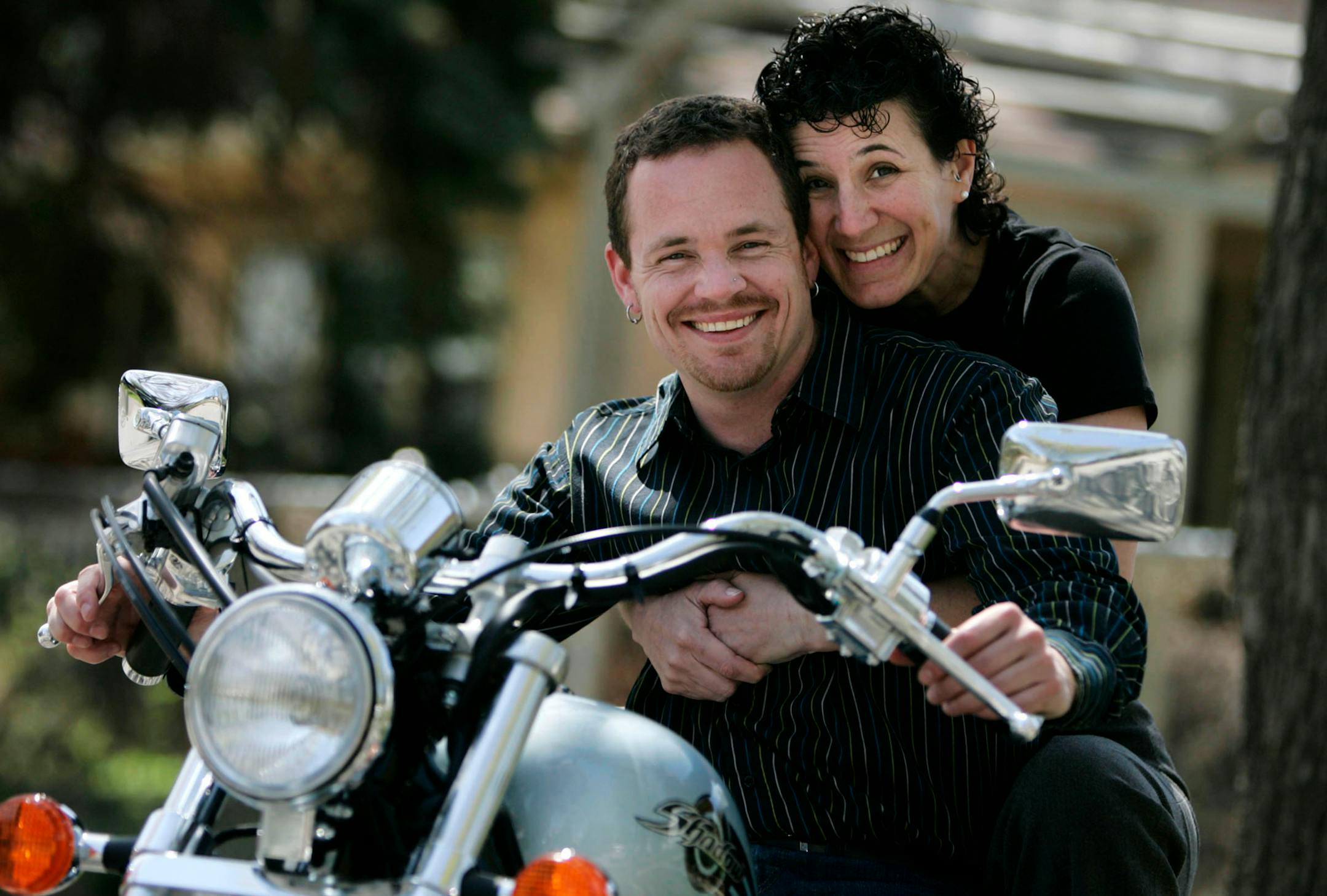 Alex Nelson, left, completed his transition from female to male many years ago and is planning his wedding to Tamar Jackson, a woman he has known for many years. Among the activities Nelson and Jackson enjoy is riding together on Nelson's motorcycle.