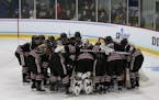 Hamlnie players gathered before the NCAA Division III women's hockey championship game aganist Plattsburgh State on March 16, 2019, at St. Thomas Ice 