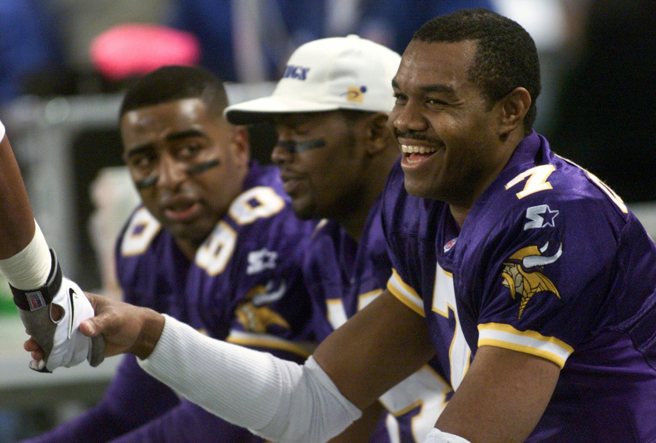 unstoppable, until: (Top, from right) Randall Cunningham, with Randy Moss and Cris Carter, led what was, in 1998, the most prolific offense in NFL history. The only miss by kicker Gary Anderson that season came at a most inopportune time vs. the Falcons.