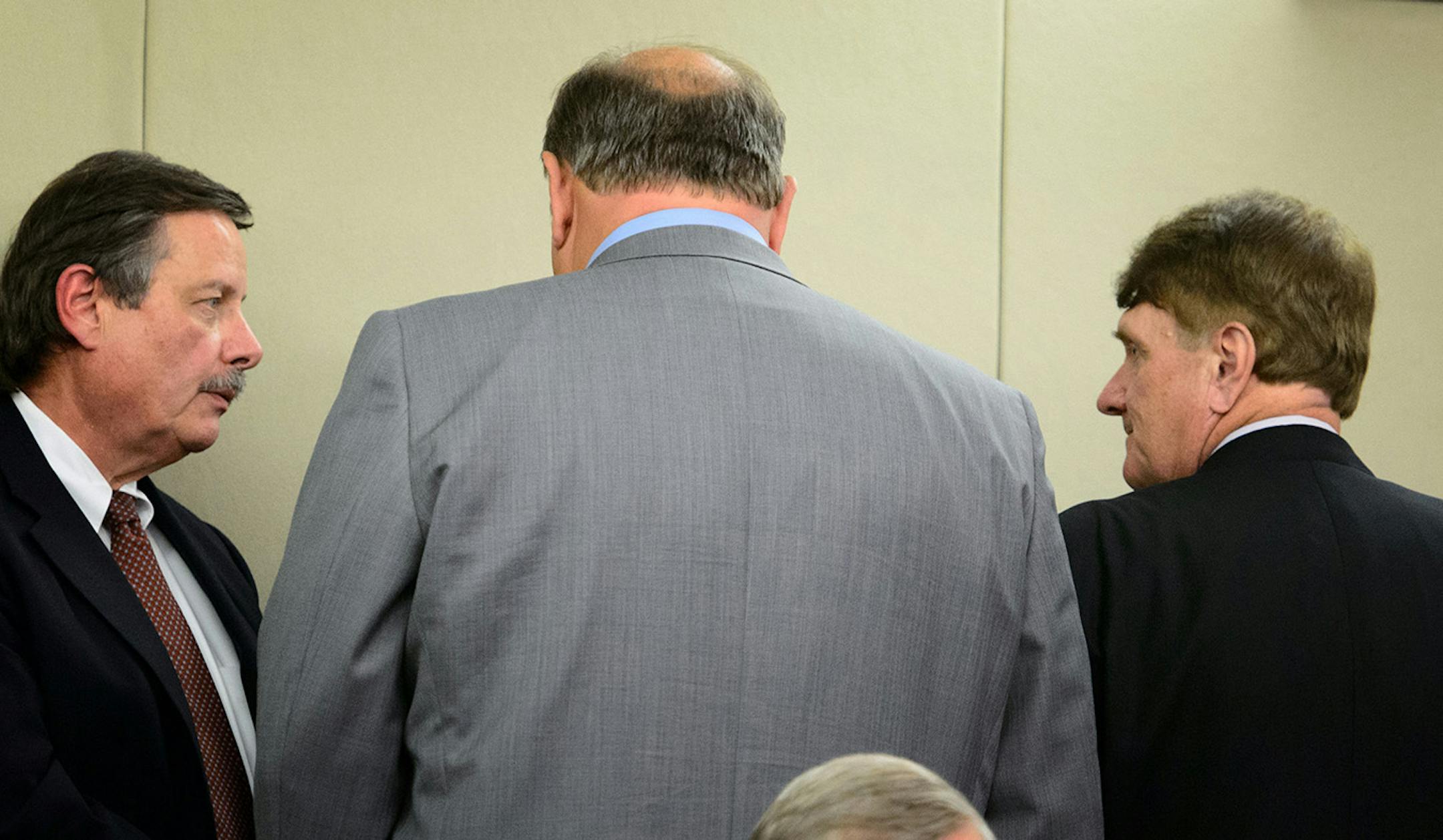 After losing the Ag and Environmental bill by one vote, Senate Majority Leader Tom Bakk worked the room, here talking with his chief of staff Tom Kukielka, left and Sen. Charles Wiger.