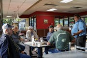 Sleepy Eye's elders gather at Hardee's for coffee as the town grapples with the impending loss of its 89-year-old Del Monte cannery. They remember tou