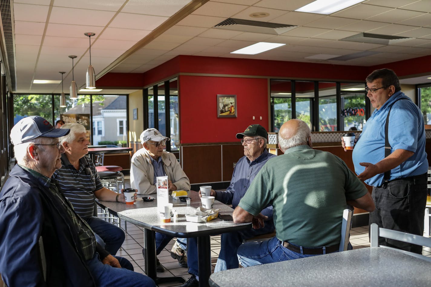 Sleepy Eye's elders gather at Hardee's for coffee as the town grapples with the impending loss of its 89-year-old Del Monte cannery. They remember tougher challenges and remain optimistic that a new buyer will emerge to save the plant. Left to right, Leon Tauer, 87, Don Domeier, 67, Alcuin Tauer, 89, Jerome Steffl, 86. Bill Lochner, 77, and Gary Vait, 66.