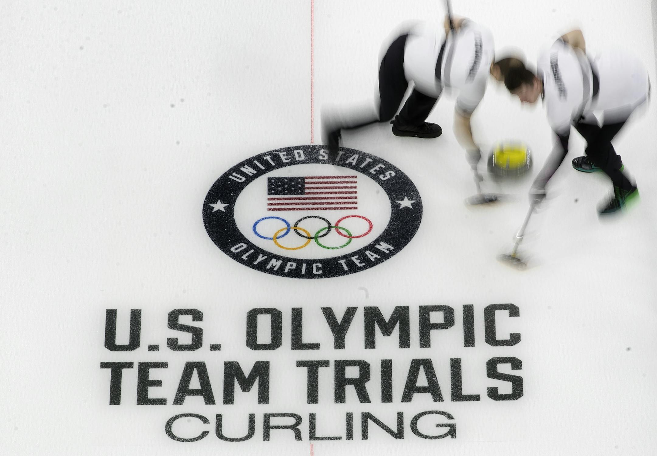 Members of Team Birr swept in front of the rock during competition on Wednesday at the U.S. Olympic curling team trials. ] CARLOS GONZALEZ ï cgonzalez@startribune.com - November 15, 2017, Omaha, NE, Baxter Arena, US Olympic curling trials