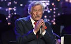 Singer Tony Bennett performs at the Statue of Liberty Museum opening celebration at Battery Park. The 92-year-old crooner keeps his voice in shape usi