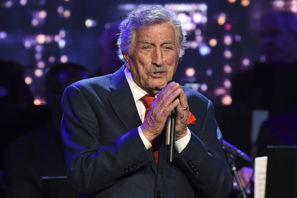 Singer Tony Bennett performs at the Statue of Liberty Museum opening celebration at Battery Park. The 92-year-old crooner keeps his voice in shape usi