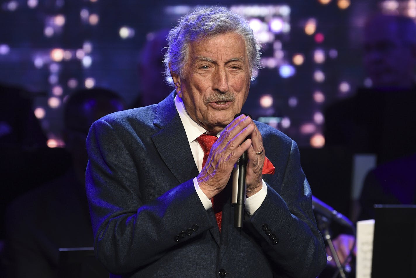 Singer Tony Bennett performs at the Statue of Liberty Museum opening celebration at Battery Park. The 92-year-old crooner keeps his voice in shape using a voice technique used by opera singers that he learned early in his career.