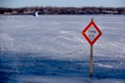 A thin ice warning on Medicine Lake in Plymouth, in 2017. Officials across Minnesota are warning of poor ice conditions on ponds and lakes after a run