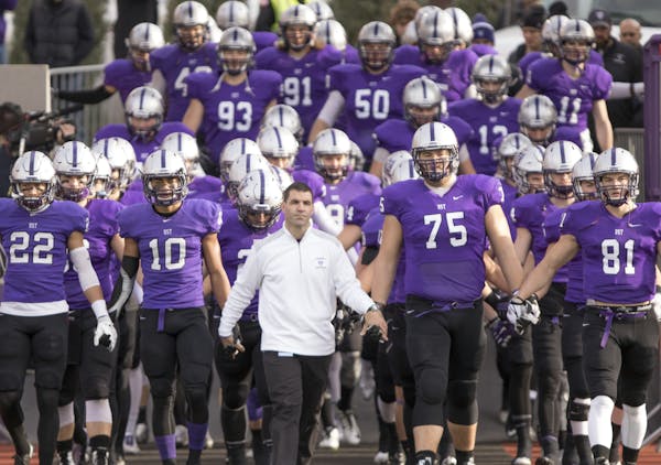 Glenn Caruso's St. Thomas football team entered the field before a game.