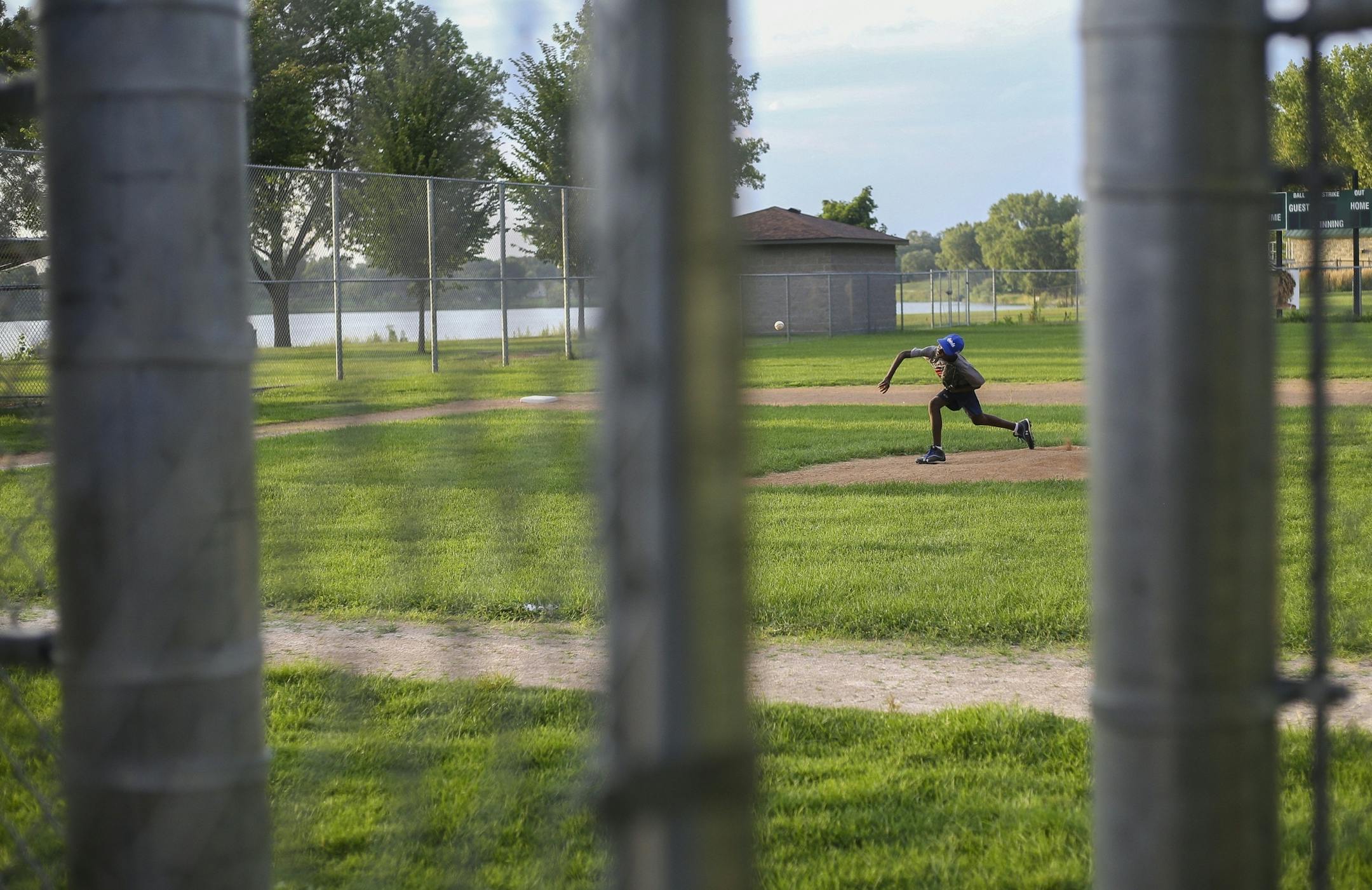 Thomas Agbo practices his pitching mechanics during practice at Lakeview Terrace Park on Monday, August 1, 2016 in Robbinsdale.