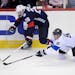 Finland (and Wild) forward Mikko Koivu (9) challenged U.S. (and former Breck and Gophers) forward Blake Wheeler (26) for the puck during the third per
