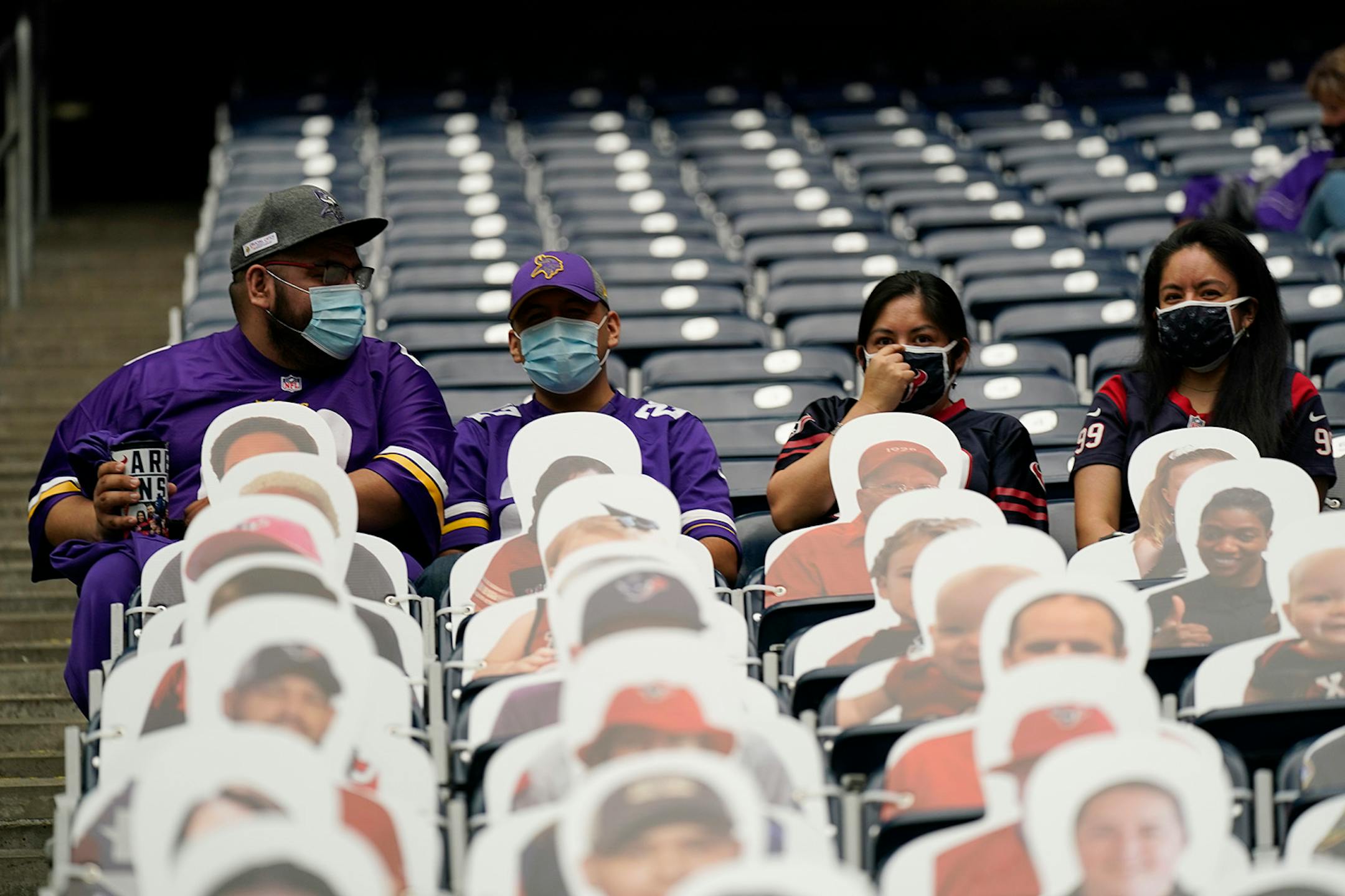 Fans arrive for an NFL football game between the Houston Texans and the Minnesota Vikings, Sunday, Oct. 4, 2020, in Houston. (AP Photo/David J. Phillip)