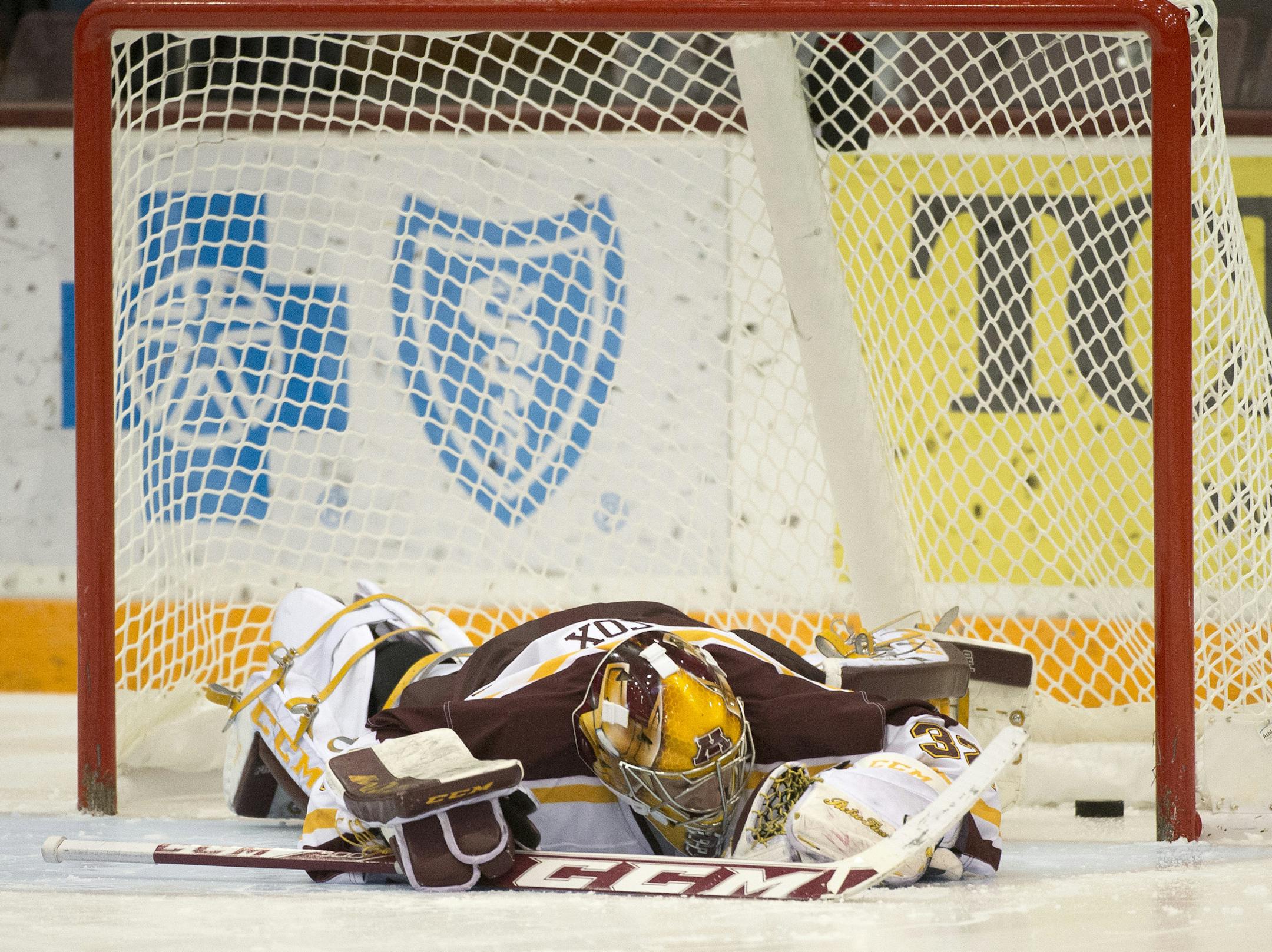 University of Minnesota goalie Adam Wilcox (32) lays down on the ice after University of Wisconsin won the game during a shoot. (Aaron Lavinsky | StarTribune) The University of Minnesota Gophers hockey team plays against the Wisconsin Badgers on Friday, Jan. 16, 2015 at Mariucci Arena.