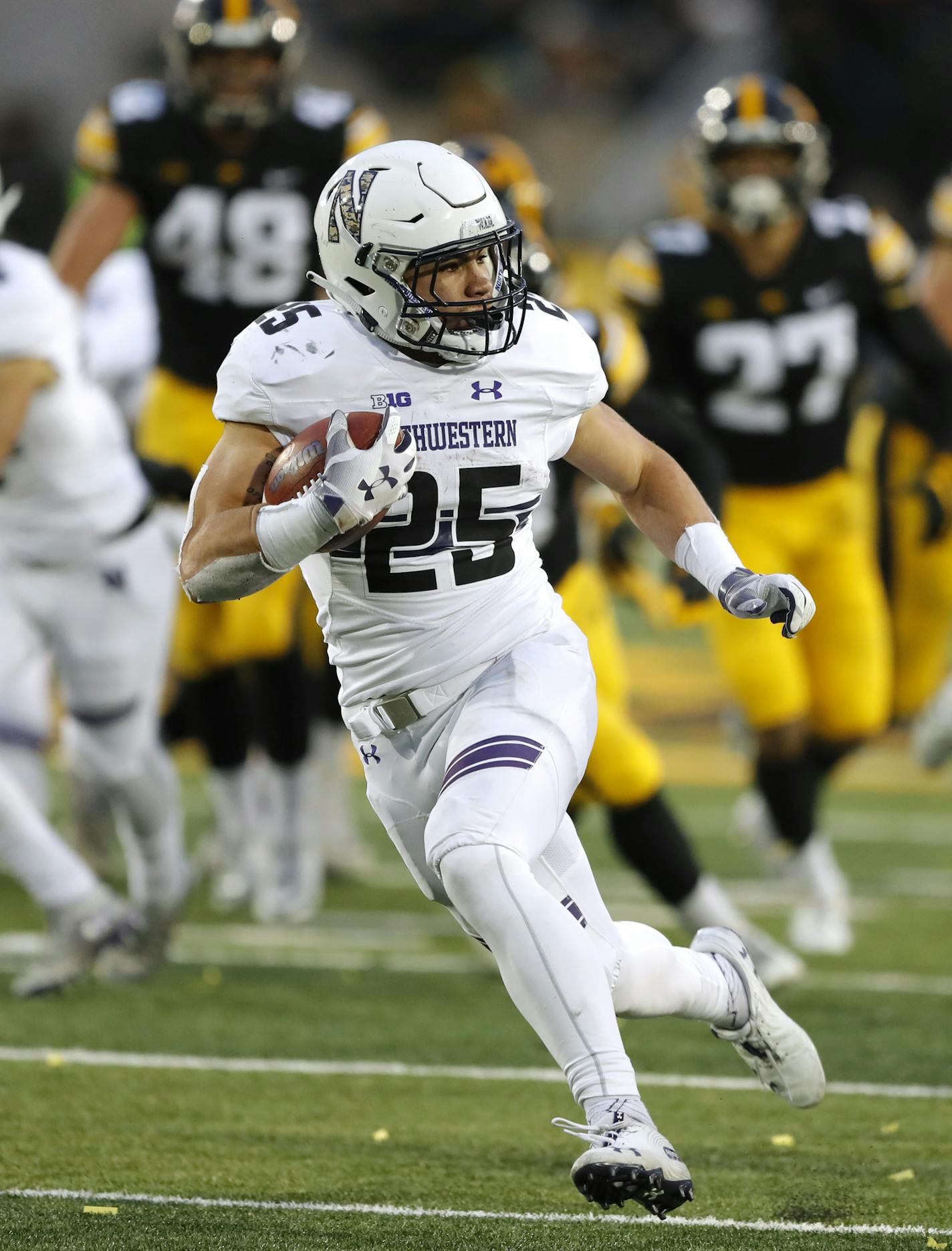 Northwestern running back Isaiah Bowser runs up field during a 34-yard touchdown run in the second half of an NCAA college football game against Iowa, Saturday, Nov. 10, 2018, in Iowa City, Iowa. Northwestern won 14-10. (AP Photo/Charlie Neibergall)