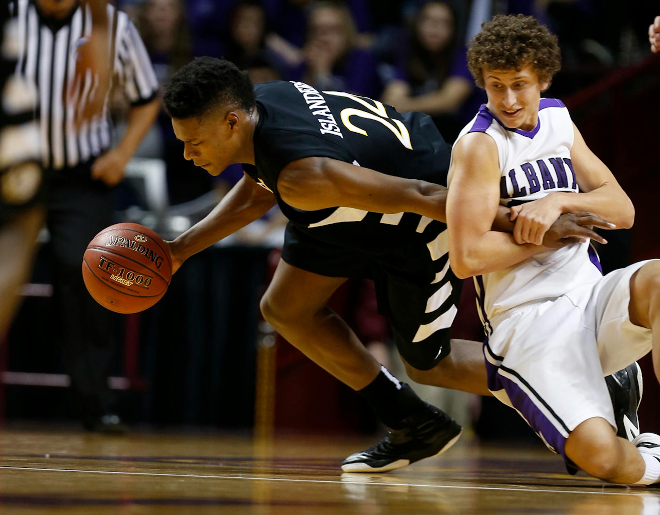 In the boys' 1A quarterfinal between Albany and DeLaSalle, Josha Collins(24) is fouled by Logan Van Drehle(30).]Richard Tsong-Taatarii/rtsong-taatarii@startribune.com