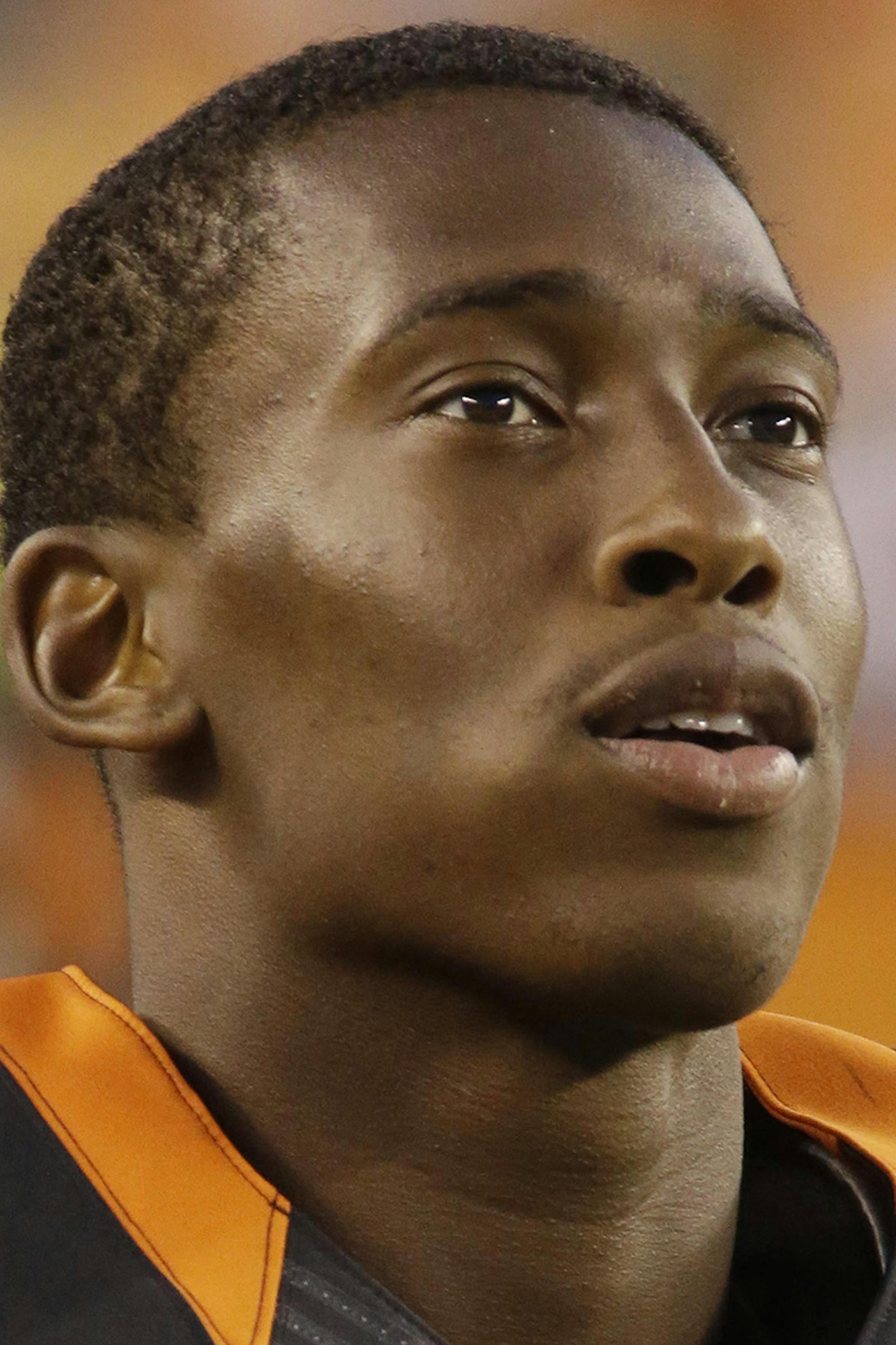 Cincinnati Bengals strong safety George Iloka watches from the sidelines in an NFL preseason football game against the Indianapolis Colts, Thursday, Aug. 28, 2014, in Cincinnati. (AP Photo/Tom Uhlman) ORG XMIT: PBS101