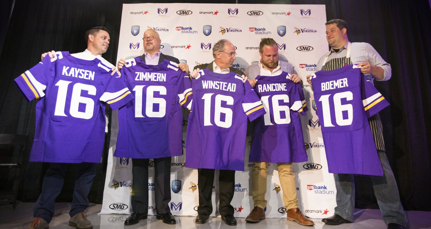 Newly announced U.S. Bank Stadium culinary partners stand for a photo op with their personalized Viking jerseys. From left is Gavin Kaysen, chef and owner of Spoon and Stable, Andrew Zimmern, three-time James Beard award winning chef, Gene Winstead, owner of Ike's Food & Cocktails, and Nick Rancone and Thomas Boemer, co-owners of Revival. ] (Leila Navidi/Star Tribune) leila.navidi@startribune.com BACKGROUND INFORMATION: Officials with the Minnesota Vikings, the Minnesota Sports Facilities Author