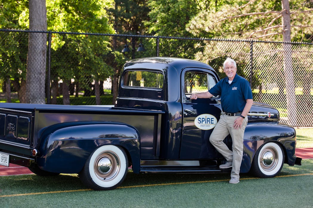 Spire Credit Union CEO Dan Stoltz with the organization's signature 1952 Ford pickup truck.
