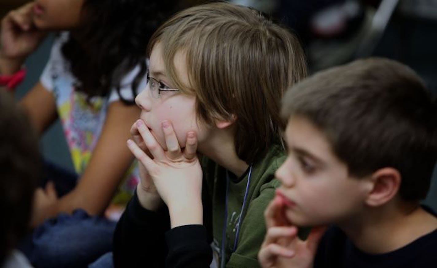 Fourth-graders Victor Labrie, left, and Taran Marin listened to "The Tortoise and the Hare" before acting it out at Lake Nokomis Community School.