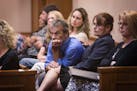 Steve and Bonnie Schaeffel, center, the grandparents of Nick Brady, listen during a Minnesota Supreme Court appeal hearing on the Byron Smith case at 