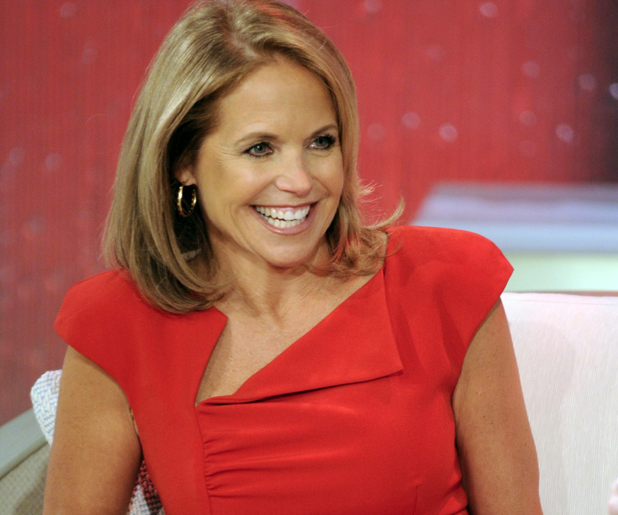 This Aug. 9, 2012 photo released by Disney-ABC Domestic Television shows host Katie Couric during a taping of her new talk show "Katie." Couric's new show will debut on Monday, Sept. 10. (AP Photo/Disney-ABC Domestic TV, Ida Mae Astute) ORG XMIT: MIN2012090710345346