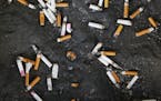 FILE - This Thursday, Sept. 17, 2015 file photo shows an ashtray with cigarette butts outside the Oklahoma County Courthouse in Oklahoma City. Researc