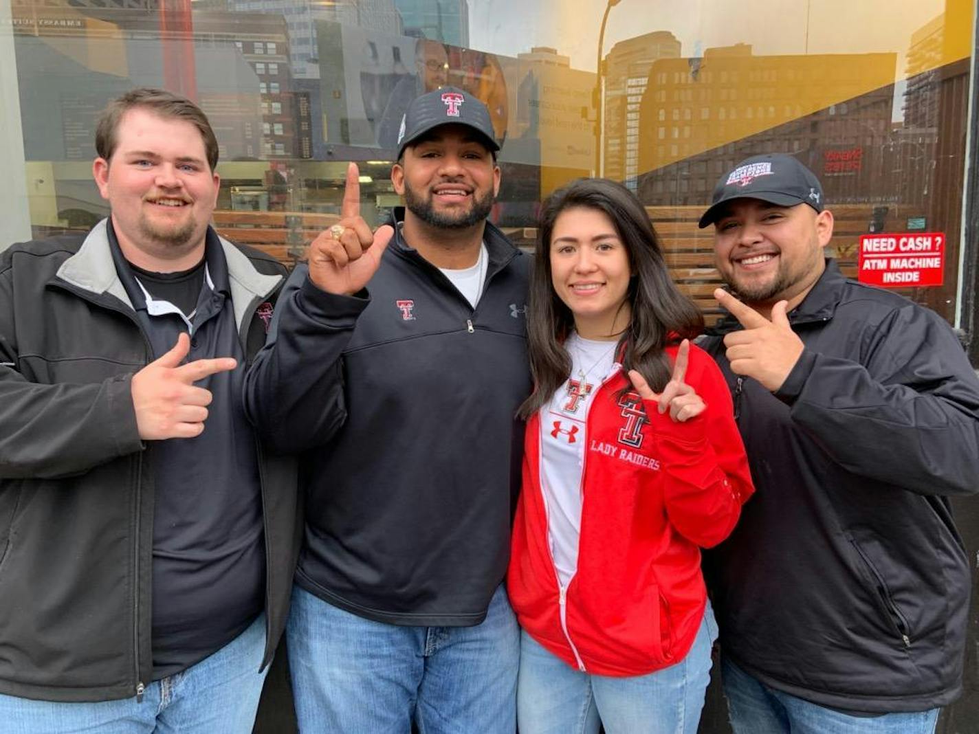 From left, Texas Tech fans Ryan Woodham, Paul Childers, Mia Castaneda and John Juarez in downtown Minneapolis on Sunday, the day before the Red Raiders played Virginia in the national championship game.