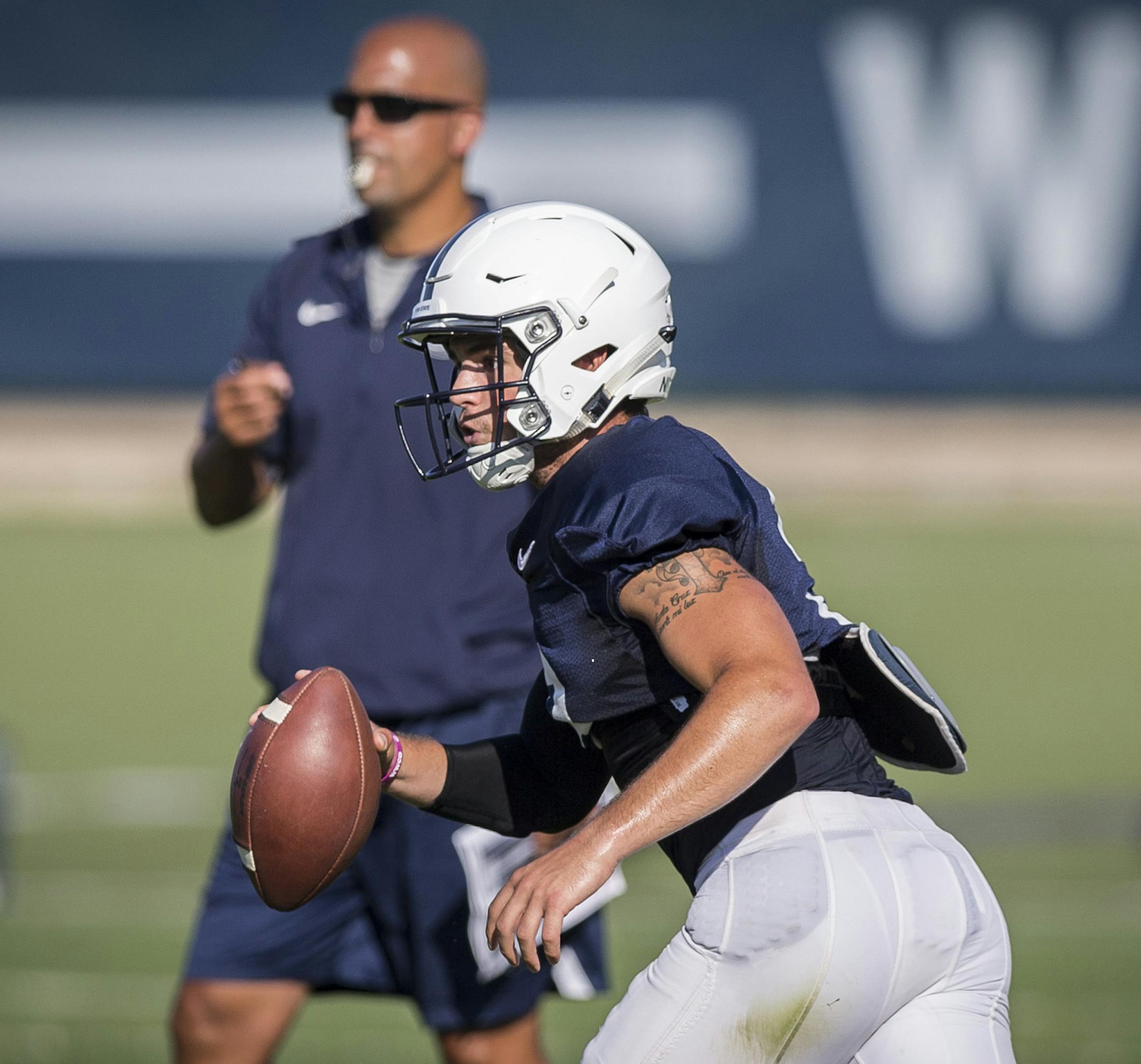 Penn State coach James Franklin watches as quarterback Trace McSorley looks downfield during NCAA college football practice Wednesday, Aug. 16, 2017, in State College, Pa. (Joe Hermitt/PennLive.com via AP) ORG XMIT: PAHAP324