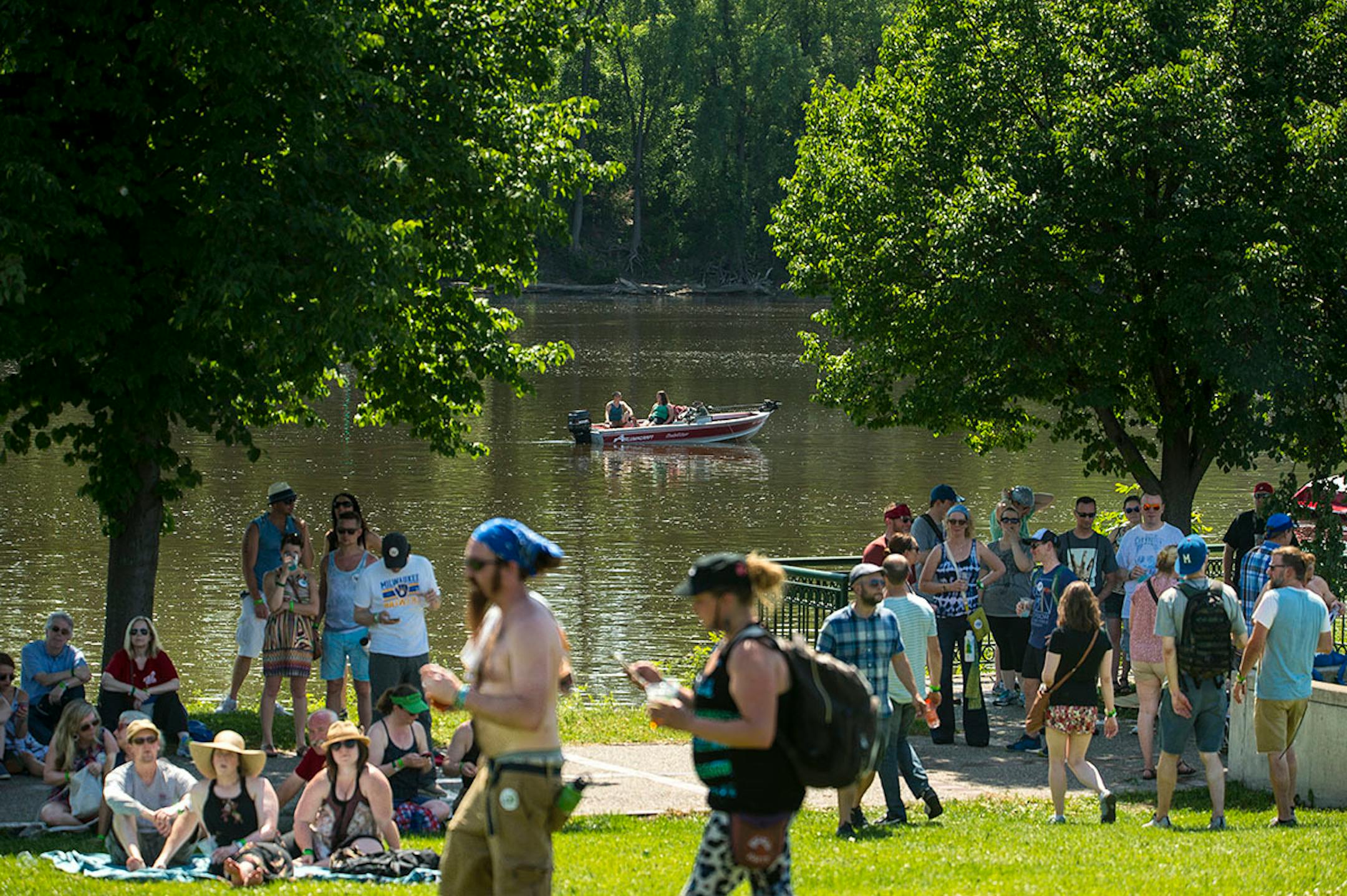 Anglers took advantage of a break in the tree line along the Mississippi River to watch Grrrl Prty during Rock the Garden Saturday night.