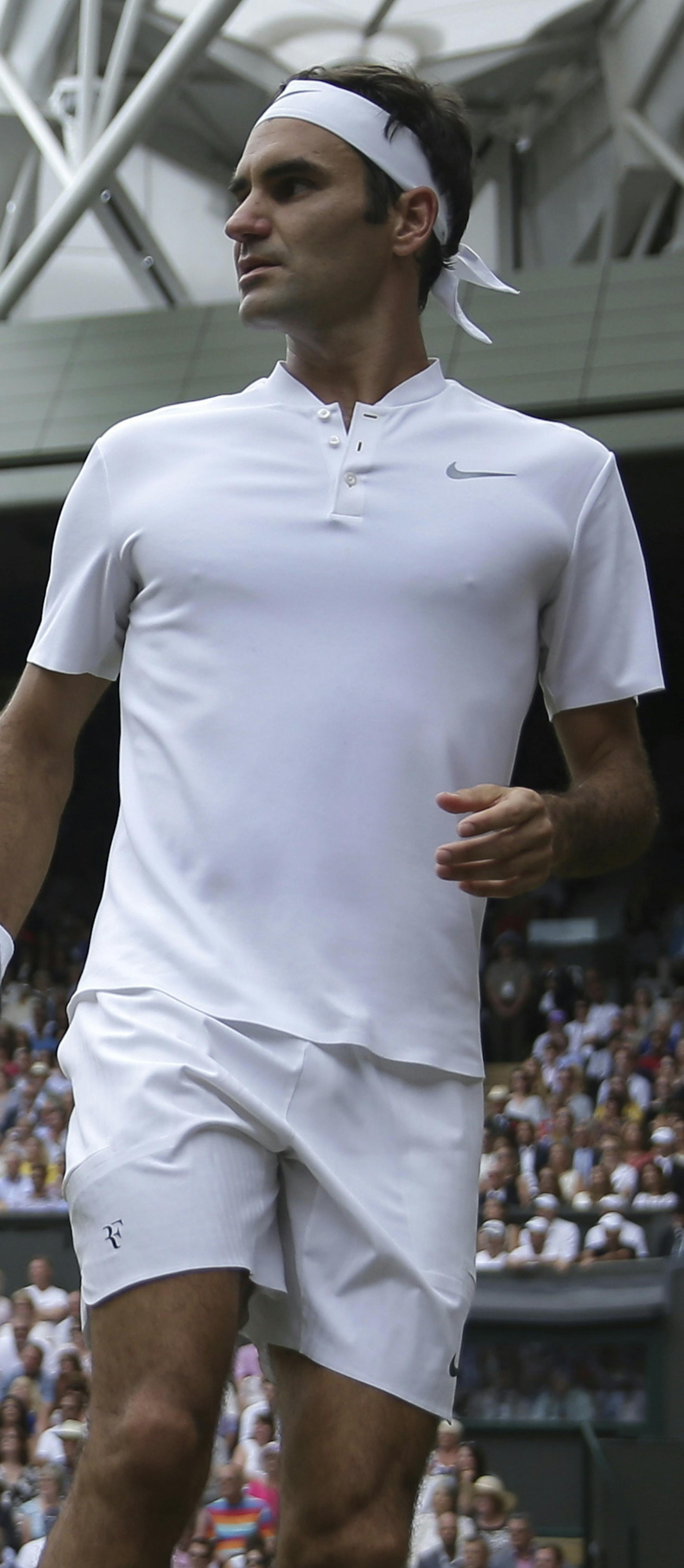 Switzerland's Roger Federer looks down the court after playing a return to Croatia's Marin Cilic during the Men's Singles final match on day thirteen at the Wimbledon Tennis Championships in London Sunday, July 16, 2017. (Daniel Leal-Olivas/Pool Photo via AP)