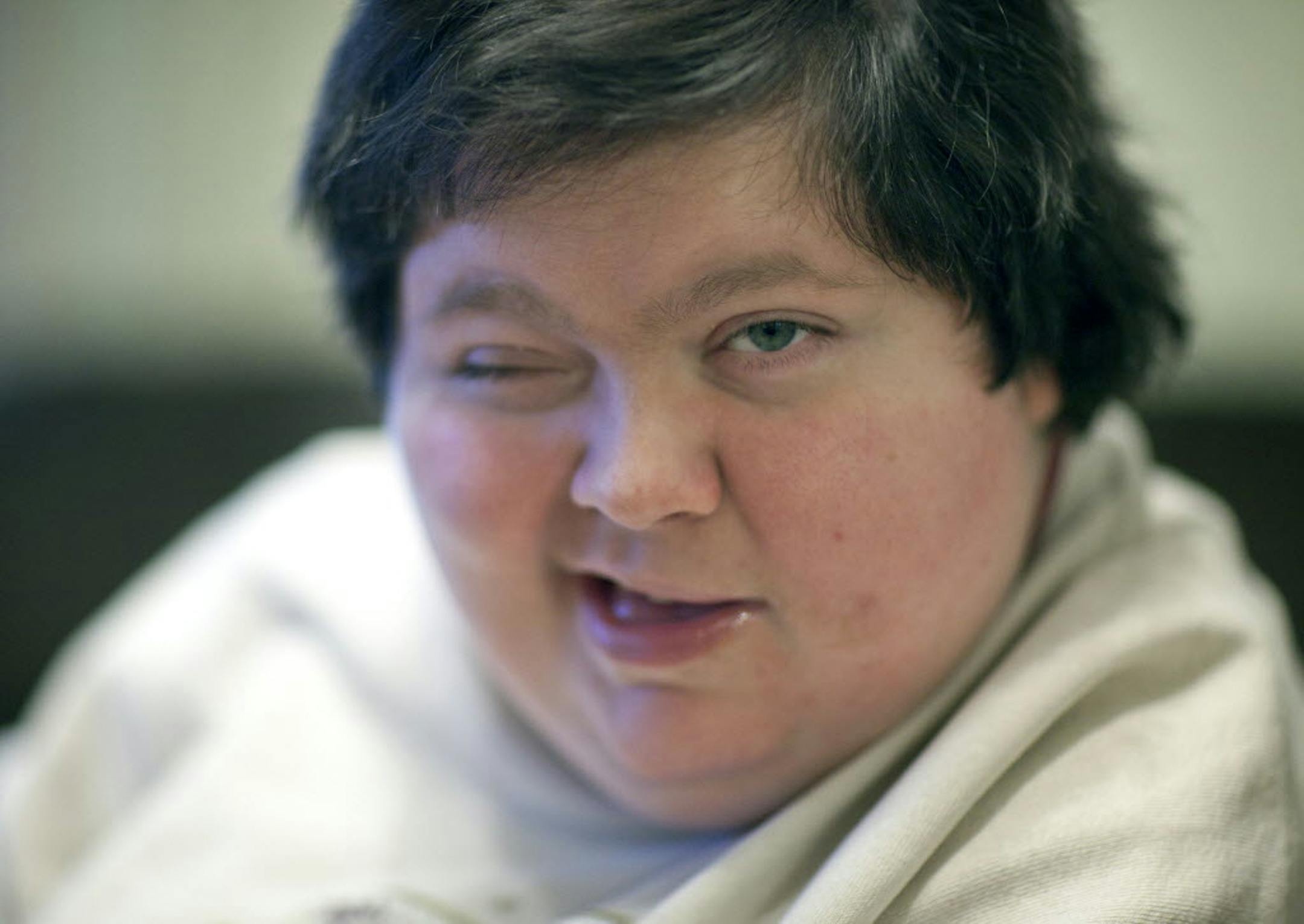 Lynda Swenson, 38, lost her ability to speak at age 6 when she was crushed in a car accident. She communicates by touching buttons on a Touch Talker.