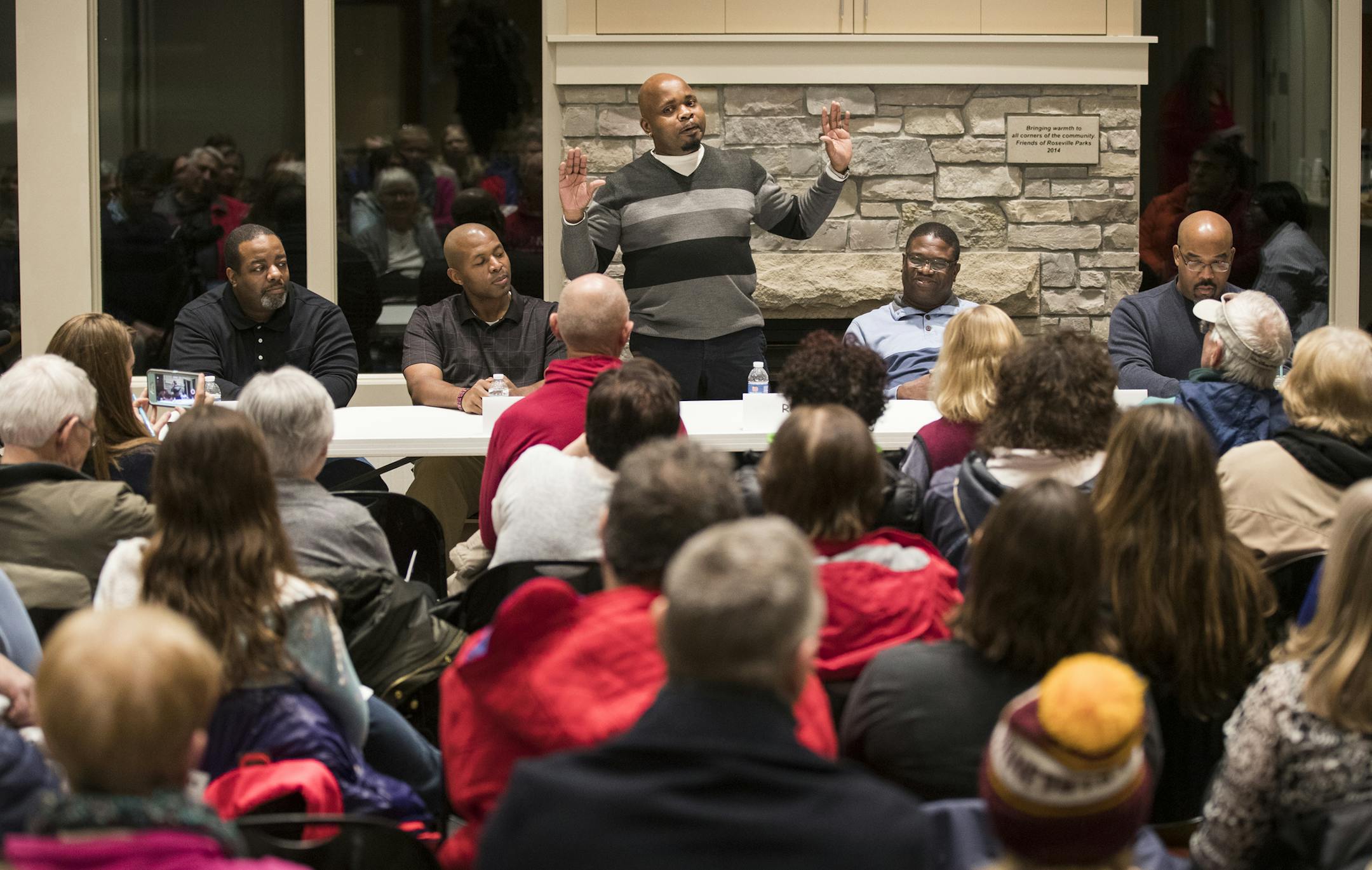 Roy Adams, center, and others speak on the panel discussion. From left is Rasheem Harris, Donald Bratton, Roy Adams, Etienne Djevi and Mark Tinsley.] LEILA NAVIDI &#xef; leila.navidi@startribune.com BACKGROUND INFORMATION: Ask A Black Man panel discussion at Roseville Library on Wednesday, February 15, 2017. Nyia Harris has assembled a panel of five black gentlemen from all walks of life from Roseville and the surrounding area to get their opinions on everything from policing to politics.