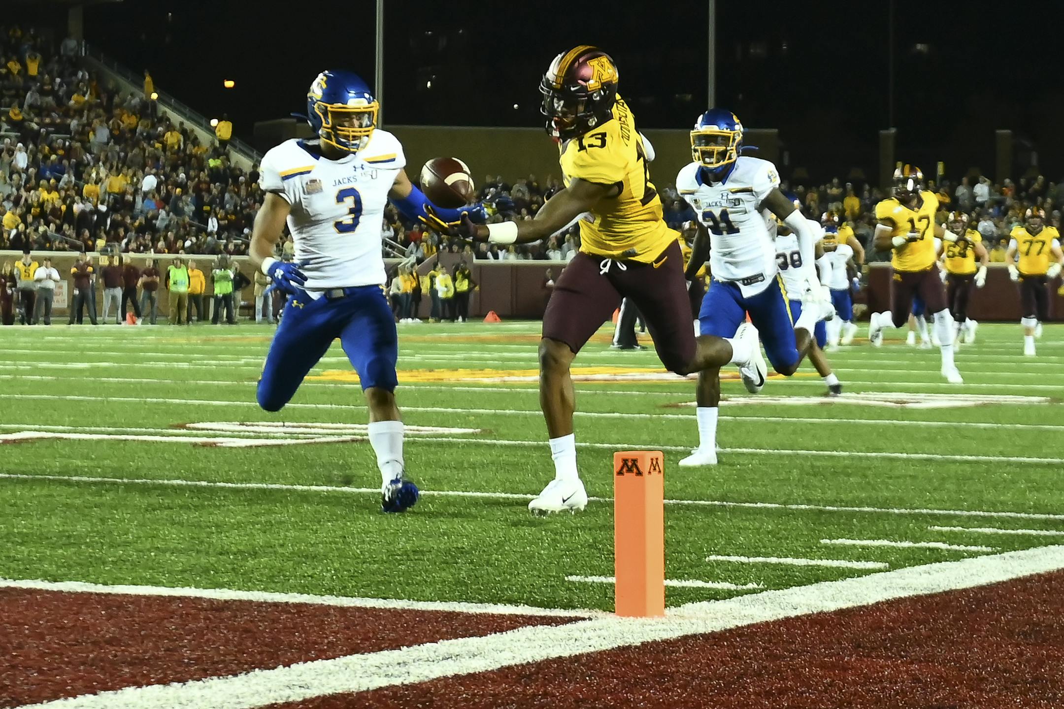 Minnesota Gophers wide receiver Rashod Bateman (13) caught the ball for a touchdown late in the second quarter with South Dakota State Jackrabbits safety Joshua Manchigiah (3) in pursuit. ] Aaron Lavinsky • aaron.lavinsky@startribune.com The Minnesota Gophers played South Dakota State Jackrabbits on Thursday, Aug. 29, 2019 at TCF Bank Stadium in Minneapolis, Minn.