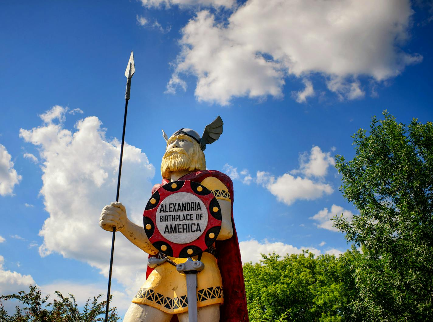 Big Ole, a 50-year-old wood and fiberglass Viking sculpture, towers near the Runestone Museum in Alexandria, Minn. Though he exudes strength, paint is peeling and birds nest in his shoulder.