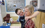 Jake Mann hugs Betsy Ferguson while working at Poquoson Middle School's Cool Beans Cafe Thursday morning March 29, 2018. Special needs students run al