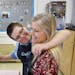 Jake Mann hugs Betsy Ferguson while working at Poquoson Middle School's Cool Beans Cafe Thursday morning March 29, 2018. Special needs students run al